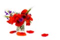 Red poppies, cornflowers, ears of green wheat, chamomile in small vase on white background with space for text Royalty Free Stock Photo