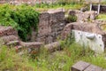 Red poppies on ruins in the historic part of Rome, Italy