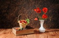 Red poppies in a vase and sweet cherry Royalty Free Stock Photo