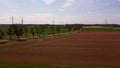 red poppyfield country road summer meadow Wonderful aerial top view flight drone