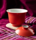 Red porcelain gaiwan with the lid off