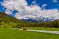 Red Porsche 911 997 in Alps mountains, Davos, Graubuenden, Swit