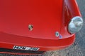 REd Porsche 911 left headlight with hood spring and logo