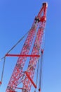 Red port crane against the blue sky Royalty Free Stock Photo