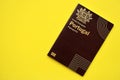 Red Portugal passport of European Union on yellow background close up