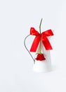 Red rose white background pitcher carafe flower milk jug gift Valentine`s day greeting card bow ribbon knot