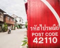 Red post box and motorbike in Chiang Khan, Loei, Thailand Royalty Free Stock Photo