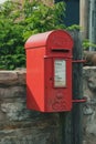 Red Post Box in a rural location in England Royalty Free Stock Photo