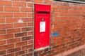 Red post box in Sutton, St Helens, Merseyside Royalty Free Stock Photo