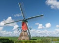 Traditional red post mill in a meadow, Rode Molen, Oud Ade, the Netherlands