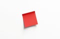 Red post-it note or sticky note isolated on white clean surface. Paper reminder or memo for message or note. Blank red sticker Royalty Free Stock Photo