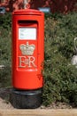 Red Postbox at Center Parcs Elveden Forest Village, Thetford, UK Royalty Free Stock Photo