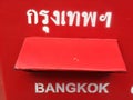 Red postbox and letters insert in Bangkok, Thailand