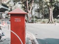 Red postbox for mailing on street side Royalty Free Stock Photo