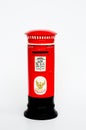 Red postbox on white ground Royalty Free Stock Photo