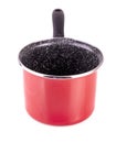 Red pot with black pen isolated on white Royalty Free Stock Photo