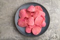 Red potato chips on gray concrete background. Top view, close up Royalty Free Stock Photo