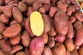 Red potatoes in a market display with half cutted Royalty Free Stock Photo