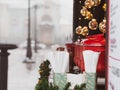 Red pots with mulled wine on Christmas market illuminated stall. Seasonal holiday street food beverages concept New year Royalty Free Stock Photo