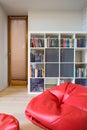 Red pouf inside modern room