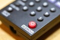 A red power button close-up on TV remote control Royalty Free Stock Photo