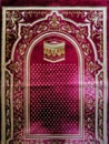 The red prayer rug is a device made of cloth that usually has an image and style that breathes Islam. Prayers are used by Muslims Royalty Free Stock Photo