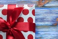 Red present box on vintage wooden board front view Royalty Free Stock Photo