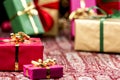 Red Present Among Other Gifts and Baubles Royalty Free Stock Photo