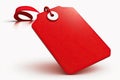 Red price tag with a ribbon on a white background Royalty Free Stock Photo