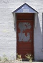 Red Private Door With White Bricks