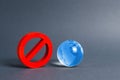 Red prohibition symbol NO and planet earth glass ball. Prohibitions, obstacles and censorship, opponents of globalization