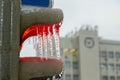 A red prohibitory sign for pedestrians lit up at the traffic light, there was heavy icing. Icicles hang in the city. Royalty Free Stock Photo