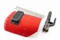Red protective screen and rod-holder with Welding electrodes wire. Royalty Free Stock Photo