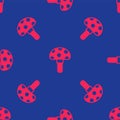 Red Psilocybin mushroom icon isolated seamless pattern on blue background. Psychedelic hallucination. Vector