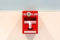 Red Pull Down Fire Alarm Hanging on Wall Royalty Free Stock Photo