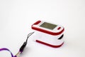 A red pulse oximeter on the isolated white background Royalty Free Stock Photo