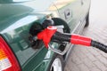 Red pump for refueling filling green car
