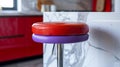 Red and purple bar stool in a modern kitchen setting Royalty Free Stock Photo