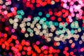 Red, purple, pink, blue, magenta, green and gold bokeh on dark background. Royalty Free Stock Photo