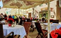 Street Cafe Tables chairs with cup of coffee Flowers City lifestyle Summer Day In Old Town Of Tallinn travel and tourism To Est