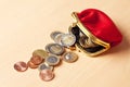 Red purse filled with euro coins Royalty Free Stock Photo