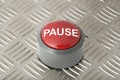 Red Push Button Labeled `Pause` on Aluminum Diamond Plate Backgr