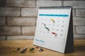 Red push pin marked on 29th of white calendar  on wooden desk Royalty Free Stock Photo