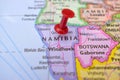 Red Push Pin Pointing Namibia on Location of World Map Close-Up View
