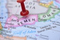 Red Push Pin Pointing Yemen on Location of World Map Close-Up View