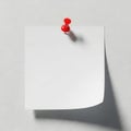 A red pushpin holding a blank piece of paper on a textured wall Royalty Free Stock Photo