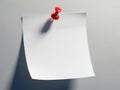Red pushpin securing a blank note on a wall Royalty Free Stock Photo