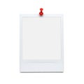 Red pushpin securing a blank note on a white wall Royalty Free Stock Photo