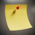 Red pushpin on yellow note Royalty Free Stock Photo
