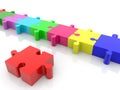 Red puzzle piece against row of colorful puzzle pieces Royalty Free Stock Photo